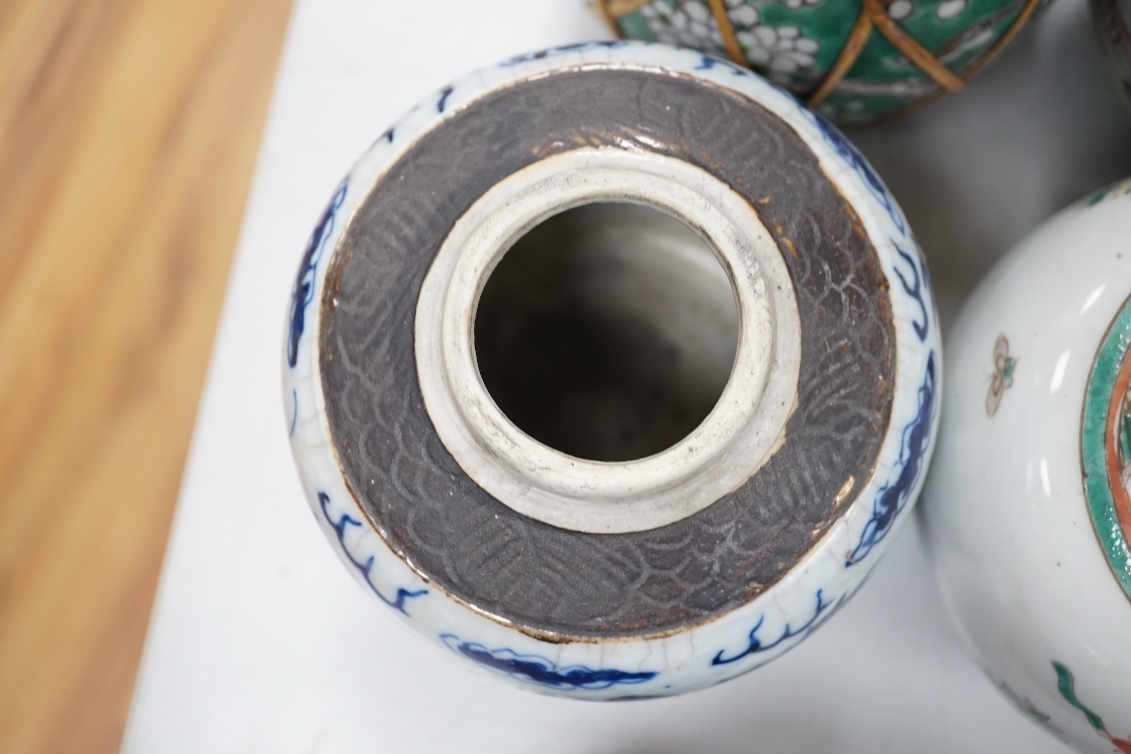 A collection of 19th and 20th century Chinese jars and covers and a blue and white vase and cover, vase 32cms high